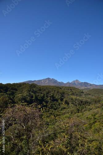 Mountains with red leaves and blue sky