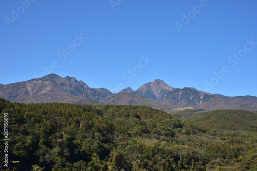 Mountains with red leaves and blue sky