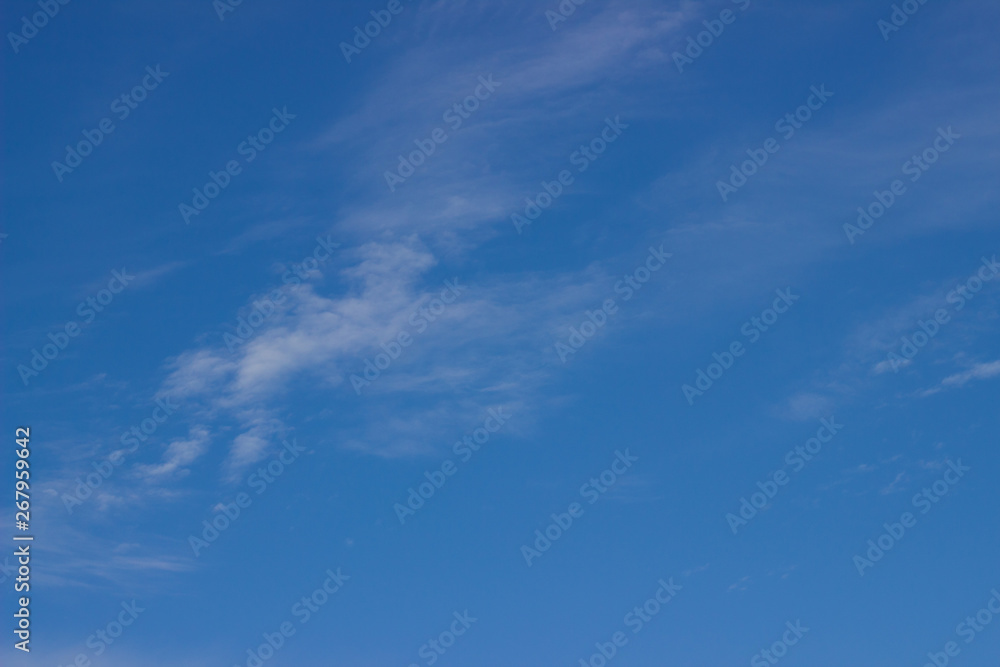 spring blue sky with white fluffy clouds
