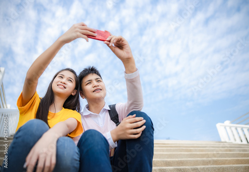 teenager boy and girl asia thailand holding hand selfie on smartphone technology