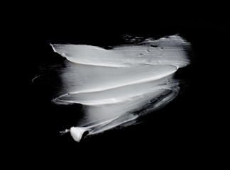white cream stroke on black background