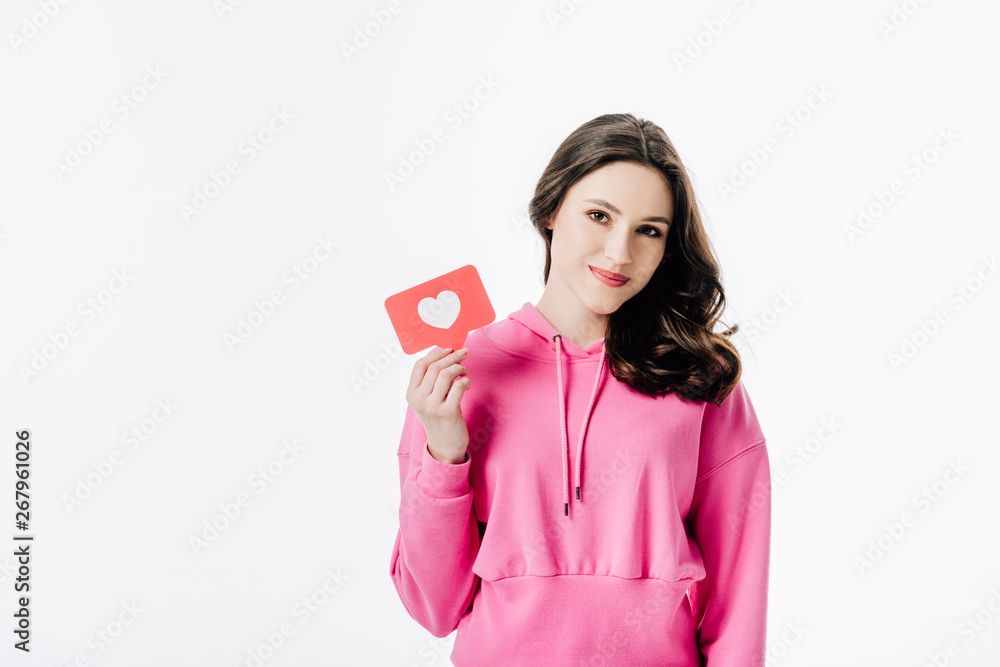 attractive young woman holding red paper cut card with heart symbol isolated on white attractive young woman holding red paper cut card with heart symbol isolated on white
