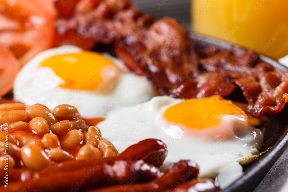 delicious English breakfast on a dark rustic background delicious English breakfast on a dark rustic background