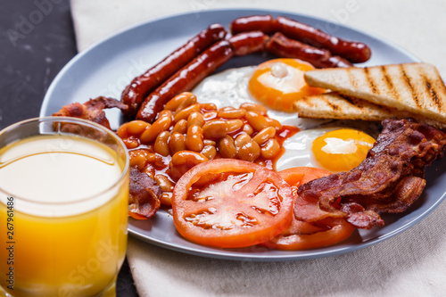 delicious English breakfast on a dark rustic background