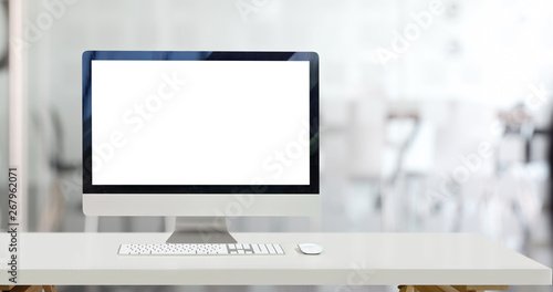 Mock up desktop computer and blank screen display in office photo