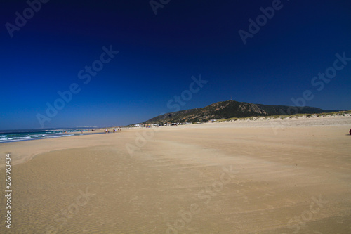 Lonely wide beach in the morning during low tide - Zahara delos Atunes at Costa de la Luz, Spain