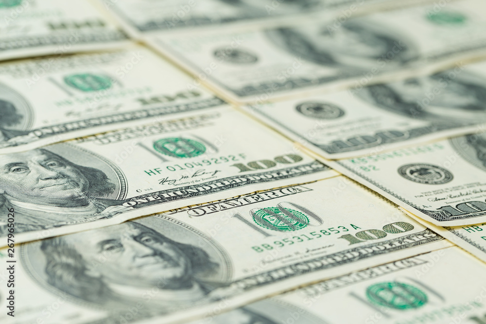 Background of one hundred dollar bills. Benjamin Franklin on USA money banknote Background of one hundred dollar bills. Benjamin Franklin on USA money banknote