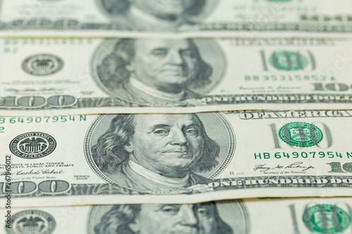 Background of one hundred dollar bills. Benjamin Franklin on USA money banknote 