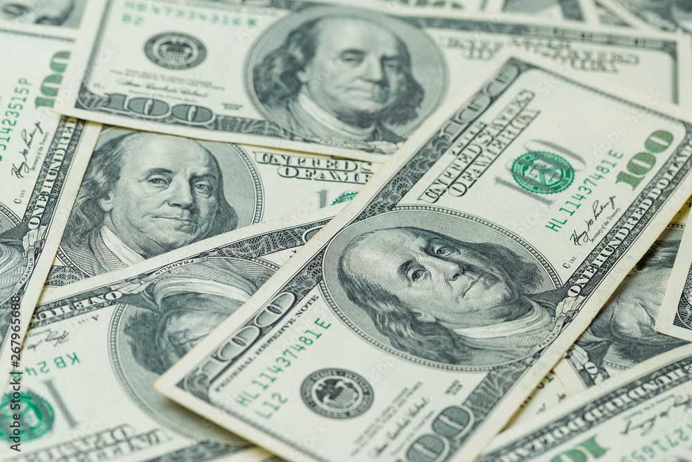 Background of one hundred dollar bills. Benjamin Franklin on USA money banknote Background of one hundred dollar bills. Benjamin Franklin on USA money banknote