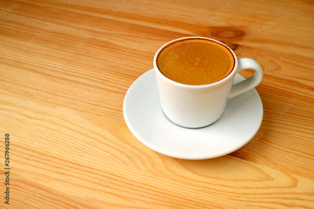 One Cup of Hot Espresso Coffee Served on Wooden Table with Free Space for Text and Design One Cup of Hot Espresso Coffee Served on Wooden Table with Free Space for Text and Design