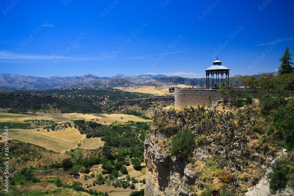 View on ancient village Ronda located on plateau surrounded by rural plains in Andalusia, Spain