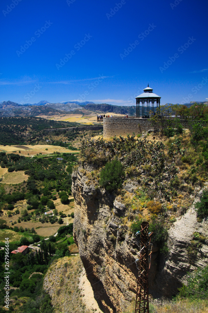 View on ancient village Ronda located on plateau surrounded by rural plains in Andalusia, Spain View on ancient village Ronda located on plateau surrounded by rural plains in Andalusia, Spain