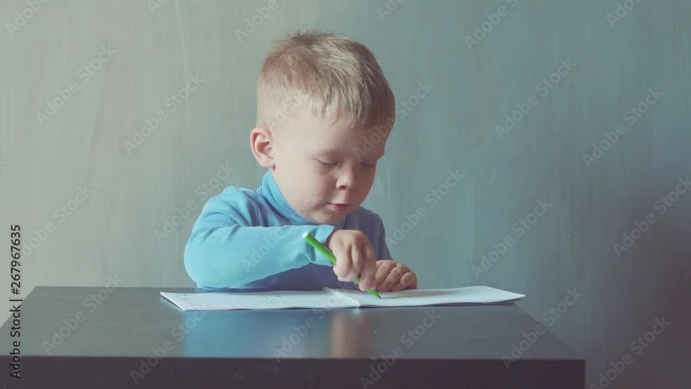 two year old boy is drawing with marker at album two year old boy is drawing with marker at album