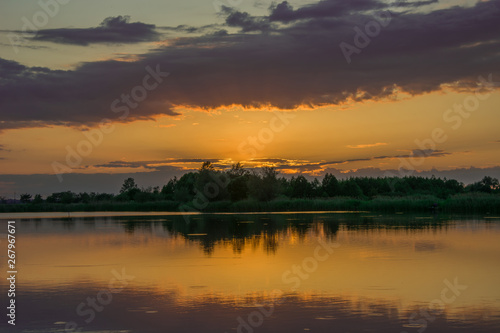 Orange sky after sunset on the lake © darekb22