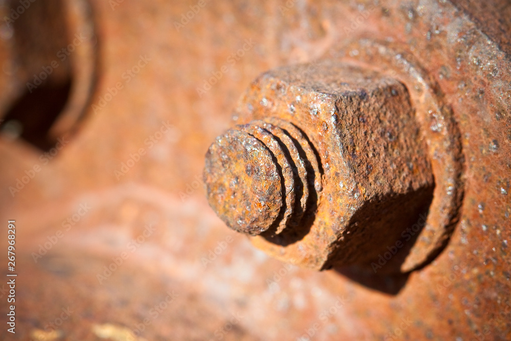 Old rusty bolt with threaded metal bar - image with copy space Old rusty bolt with threaded metal bar - image with copy space