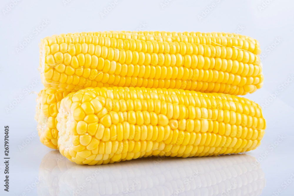 fresh raw sweet corn on the cob kernels over white background fresh raw sweet corn on the cob kernels over white background