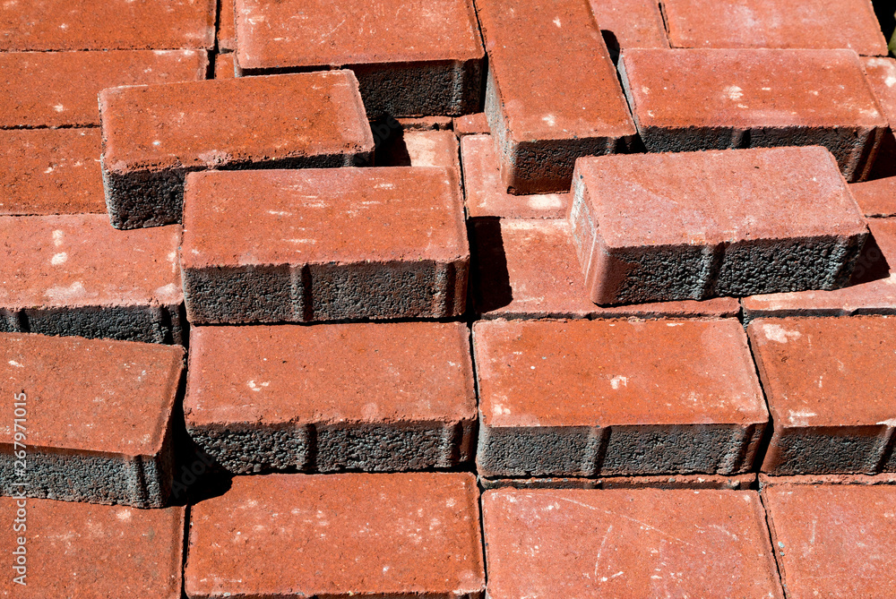 Fototapeta premium Pile of cement patio bricks for sale in a hardware store