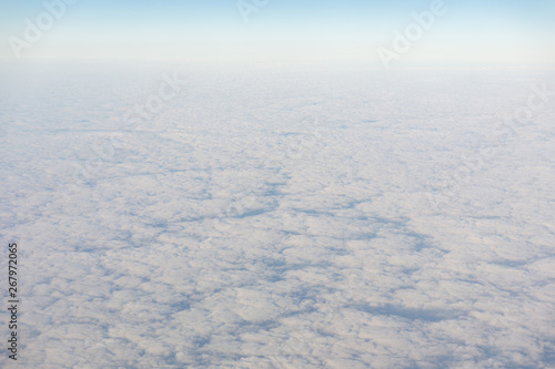 White fluffy clouds at the morning from the aircraft