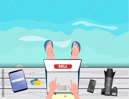 Freelance concept. Freelancer-photographer-stocker working with laptop near the sea
