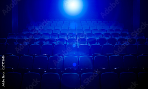 Empty movie theater with projection light falling into the lens