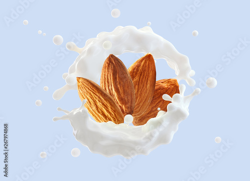 Photos Fresh natural almond milk splash swirl with almonds isolated