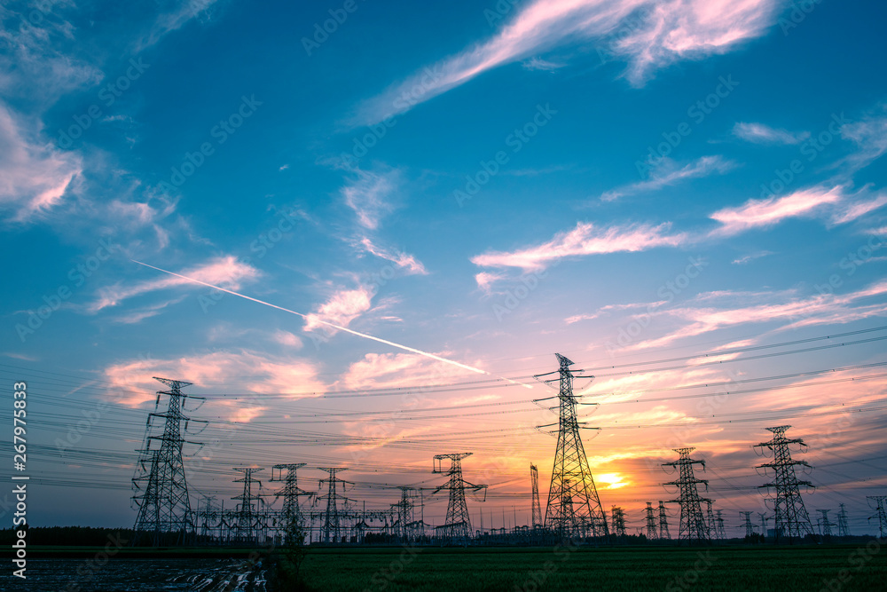 Silhouette of Power Supply Facilities at Sunset Silhouette of Power Supply Facilities at Sunset