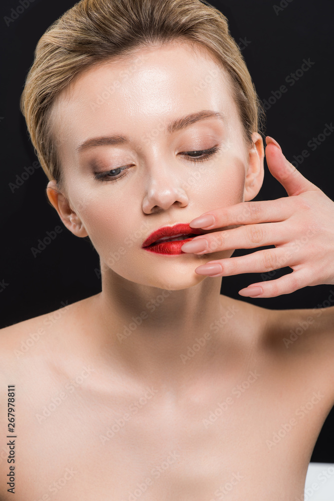 naked and attractive woman touching red lips isolated on black naked and attractive woman touching red lips isolated on black
