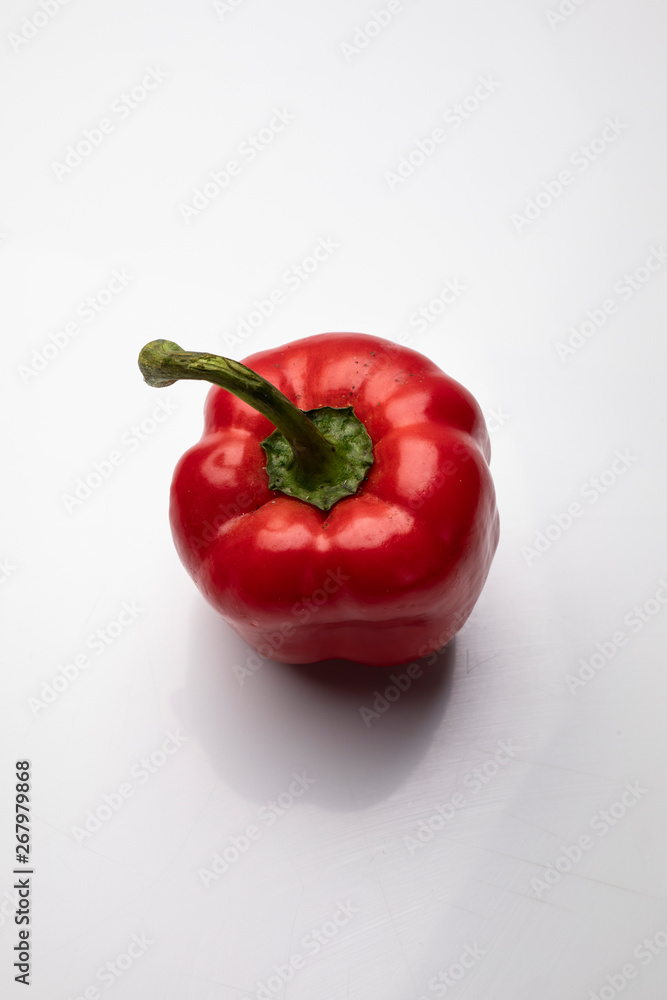 Red pepper. Fresh peppers on a white background. Red pepper. Fresh peppers on a white background.