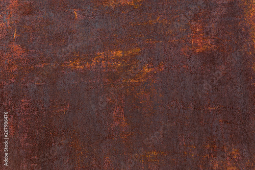 Rusty background. Old rusty metal sheet. Red rusted wall of the garage. Brown background. Grunge texture.