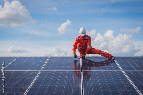 operation and maintenance in solar power plant ; engineering team working on checking and maintenance in solar power plant ,solar power plant to innovation of green energy for life photo