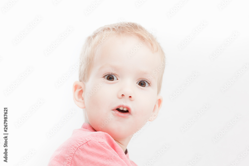 Photo of adorable young happy boy looking at camera. Photo of adorable young happy boy looking at camera.
