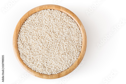 Sesame seeds in wooden bowl isolated on white background with clipping path
