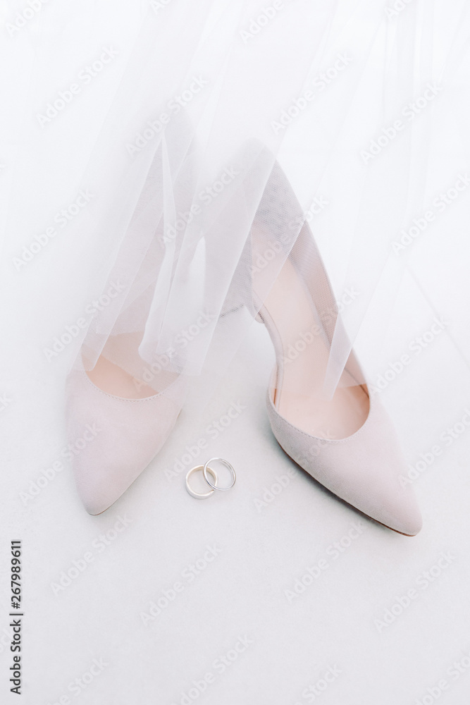 beautiful white wedding shoes of the bride. beautiful white wedding shoes of the bride.