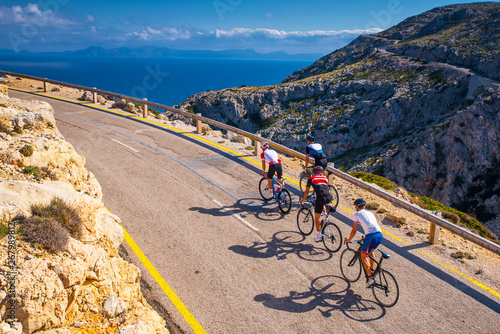 Road bikers on the road on Balearic Islands. Sea in Background. Cap de Formentor. Mallorca, Majorca, Spain
