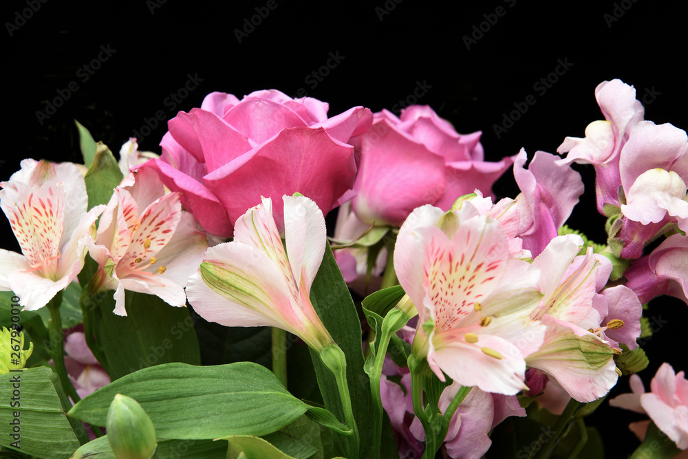 Closeup of a beautiful floral arrangement for Mothers Day or Valentines on black