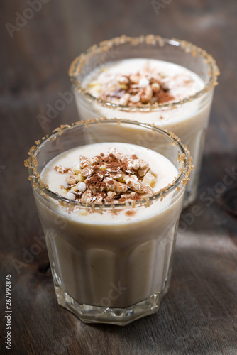 creamy cocktail with muesli, vertical