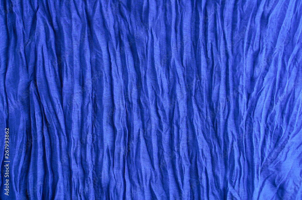 Blue fabric. Pressed cotton. Fragment of the texture. Blue fabric. Pressed cotton. Fragment of the texture.