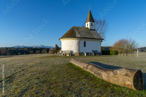 Kapelle am Chiemsee im Hintergrund die Alpen photo