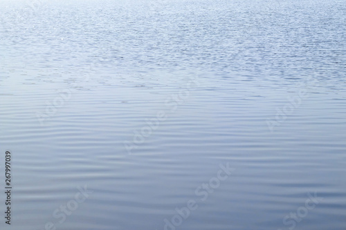 Abstract texture of a calm river water surface