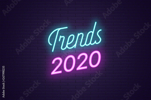 Neon lettering of Trends 2020. Glowing bright text