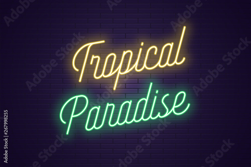 Neon lettering of Tropical Paradise. Glowing text