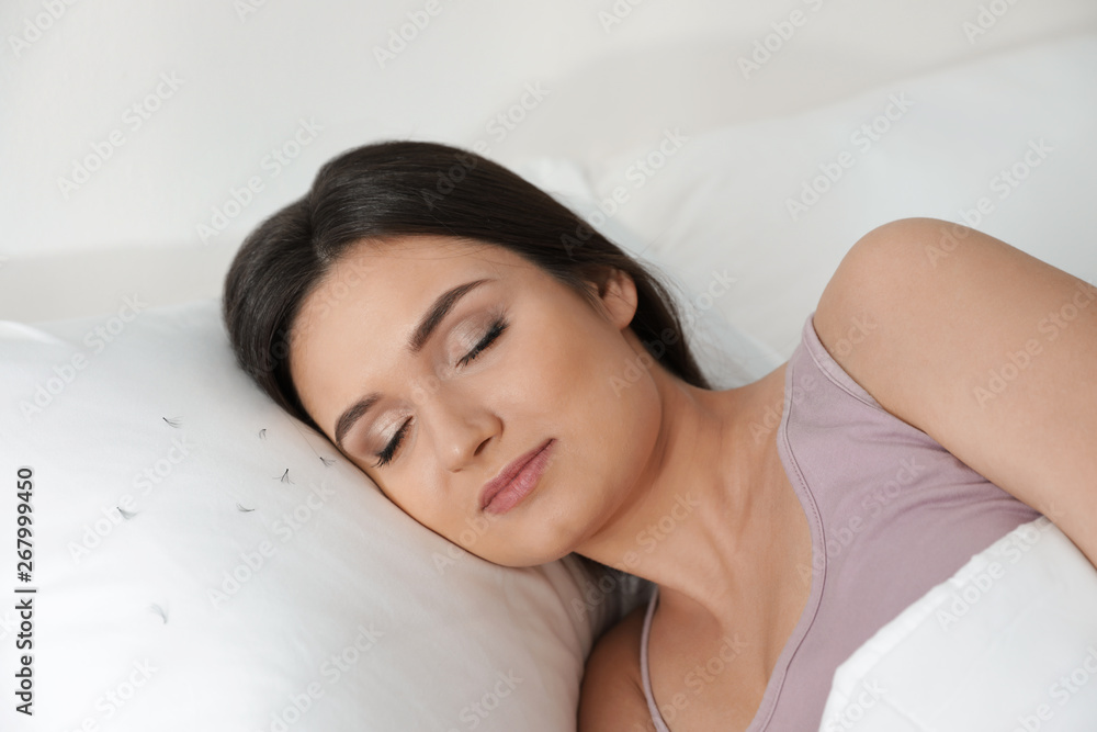 Young woman with eyelash loss problem sleeping in bed Young woman with eyelash loss problem sleeping in bed