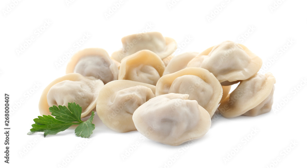 Pile of boiled dumplings with parsley leaves on white background Pile of boiled dumplings with parsley leaves on white background