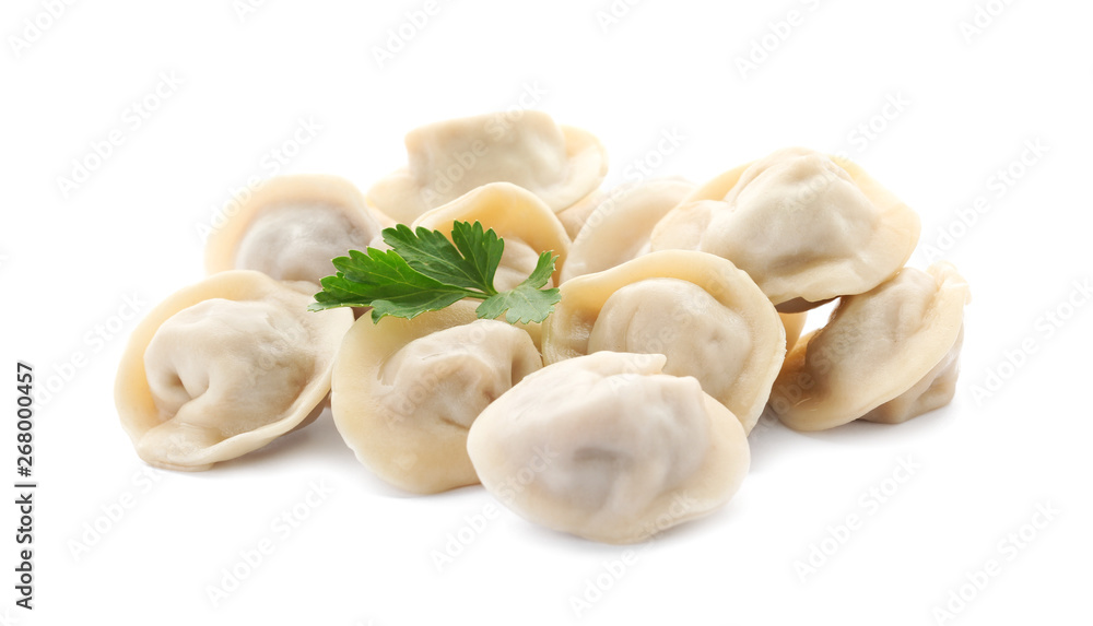 Pile of boiled dumplings with parsley leaves on white background Pile of boiled dumplings with parsley leaves on white background