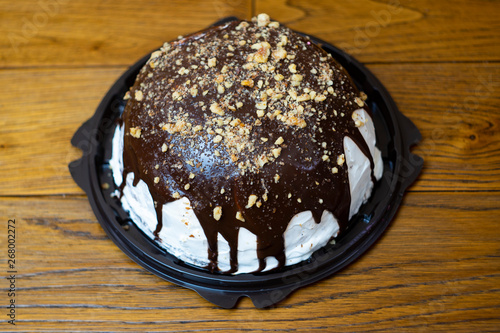 Close-up, delicious and appetizing souffle cake with chocolate sprinkled with nuts