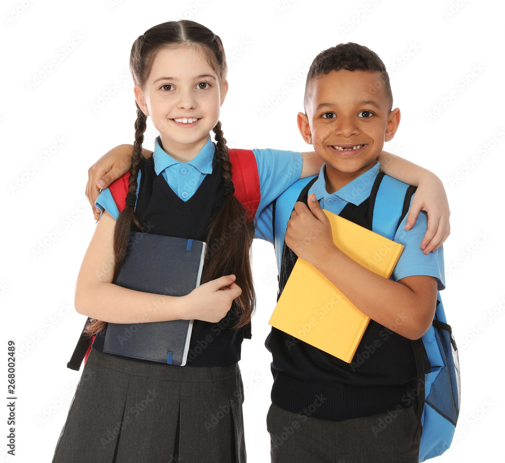 Portrait of cute children in school uniform with books on white background Portrait of cute children in school uniform with books on white background