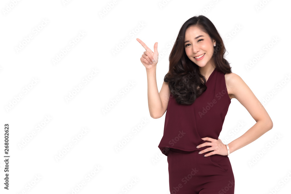 Young elegant Asian woman smiling and pointing to empty copy space isolated on white background Young elegant Asian woman smiling and pointing to empty copy space isolated on white background