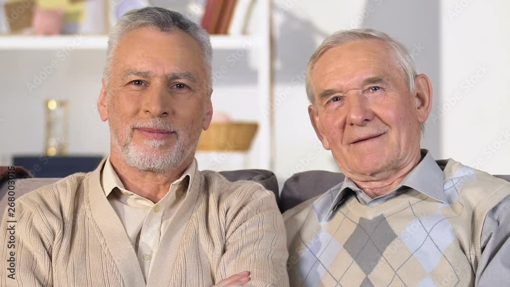 Glad old men looking camera and smiling, happy retirement, success and wealth Glad old men looking camera and smiling, happy retirement, success and wealth