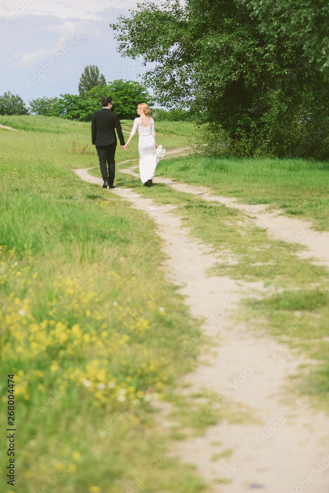 Wedding couple in a walk