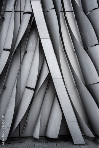 VerticalVertical bend gray aluminium modular facade with gap in repea bend gray aluminium modular facade with gap in repeat pattern / architectural texture / aluminium facade / background / abstract
